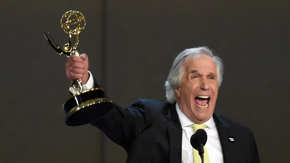Henry Winkler accepts the award for outstanding supporting actor in a comedy series for 