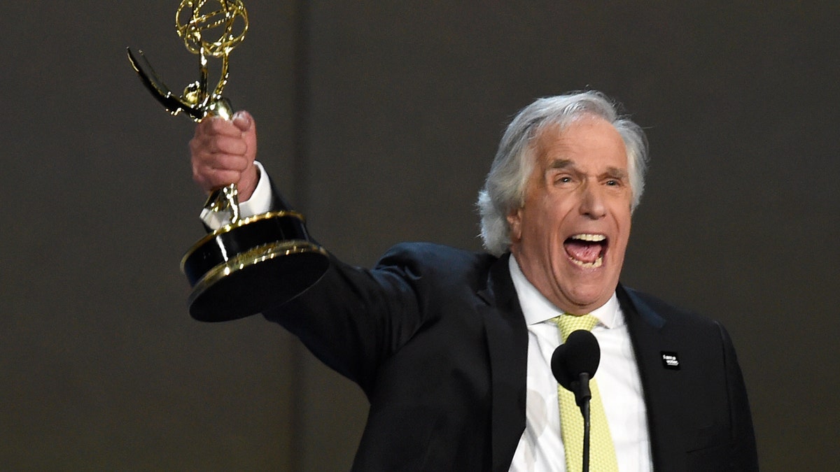 Henry Winkler accepts the award for outstanding supporting actor in a comedy series for 