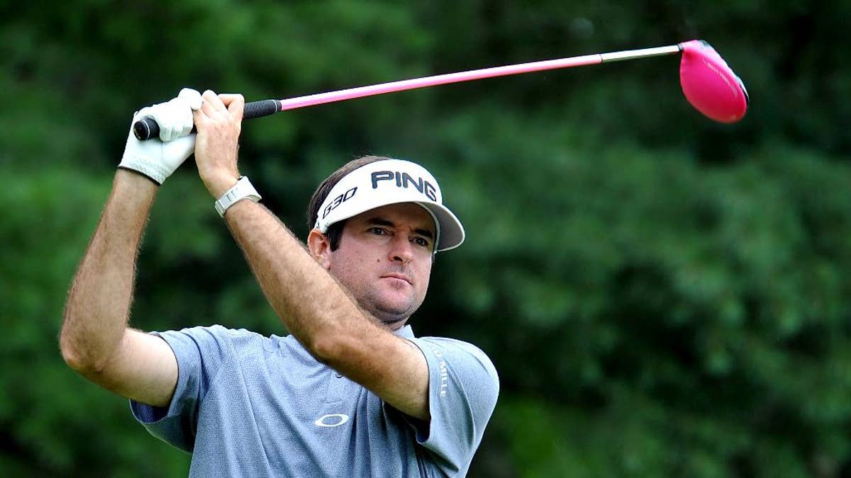 Bubba Watson watches his ball on the ninth tee during the third round of the Greenbrier Classic golf tournament at the Greenbrier Resort in White Sulphur Springs, W.Va., Saturday, July 4, 2015  (AP Photo/Chris Tilley)
