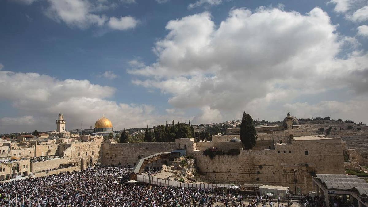 Jewish men of the Cohanim Priestly caste participate in a blessing during the holiday of Sukkot, in front of the Western Wall, the holiest site where Jews can pray in Jerusalem's Old City, in October 2016.