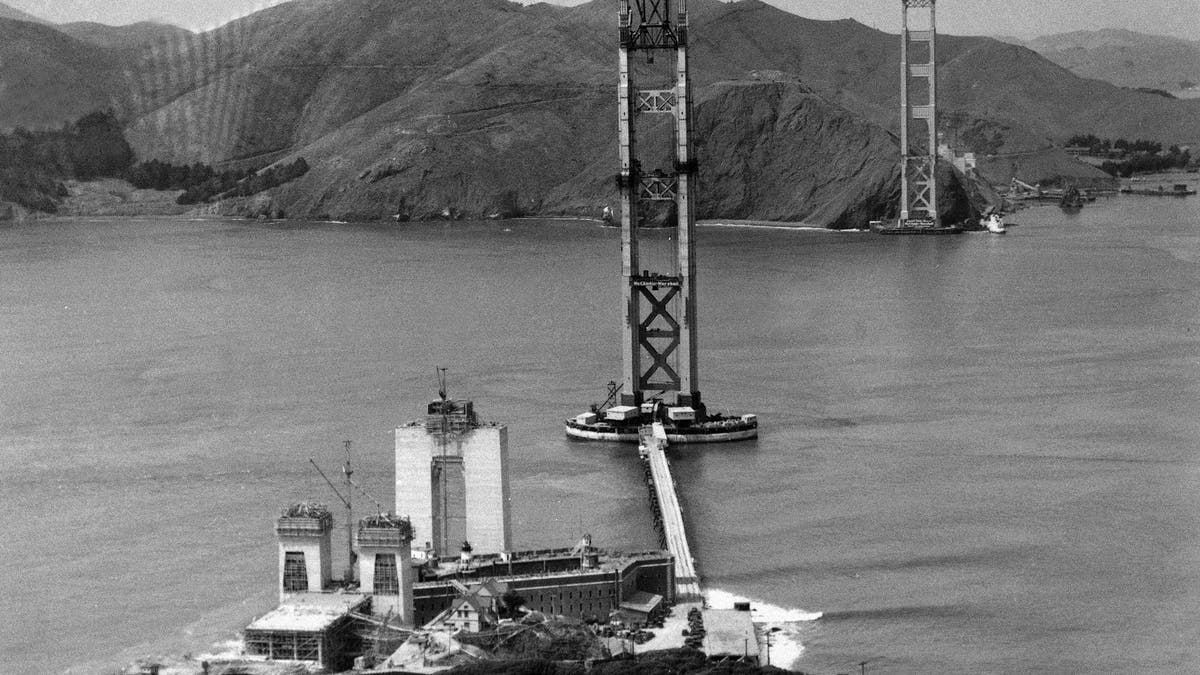 The construction of the Golden Gate Bridge, which will link Fort Point, bottom, with Marin County, Calif., top, is seen as work progressed, 1934.  (AP Photo/Redwood Empire Association)