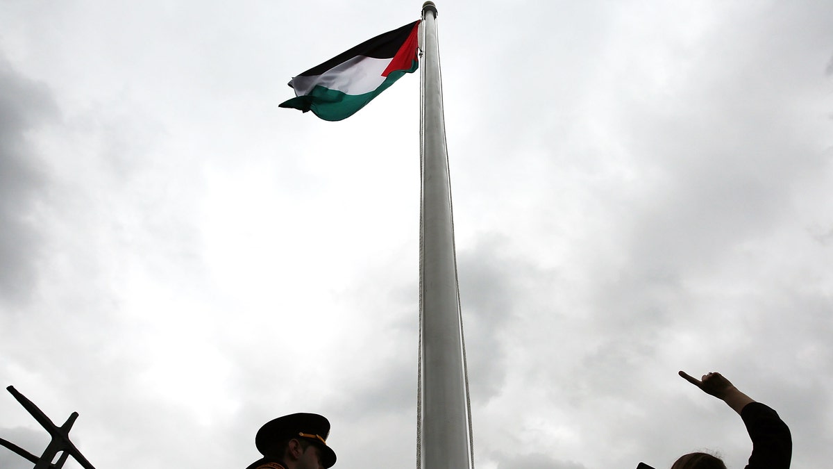 NEW YORK, NY - SEPTEMBER 30: The Palestinian flag is raised for the first time at the United Nations headquarters on September 30, 2015 in New York City. Following remarks by Palestinian President Mahmoud Abbas, the flag was raised in the rose garden at 1:00pm local time in front of a large crowd of diplomats, reporters and Palestinian supporters. (Photo by Spencer Platt/Getty Images)
