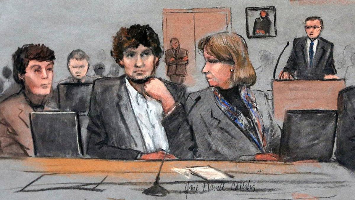 In this courtroom sketch, Assistant U.S. Attorney Aloke Chakravarty is depicted pointing to defendant Dzhokhar Tsarnaev, right, during closing arguments in Tsarnaev's federal death penalty trial Monday, April 6, 2015, in Boston. Tsarnaev is charged with conspiring with his brother to place two bombs near the Boston Marathon finish line in April 2013, killing three and injuring 260 people. (AP Photo/Jane Flavell Collins)