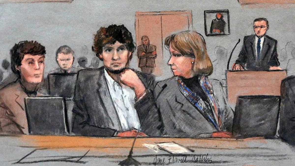 In this courtroom sketch, Assistant U.S. Attorney Aloke Chakravarty is depicted pointing to defendant Dzhokhar Tsarnaev, right, during closing arguments in Tsarnaev's federal death penalty trial Monday, April 6, 2015, in Boston. Tsarnaev is charged with conspiring with his brother to place two bombs near the Boston Marathon finish line in April 2013, killing three and injuring 260 people. (AP Photo/Jane Flavell Collins)