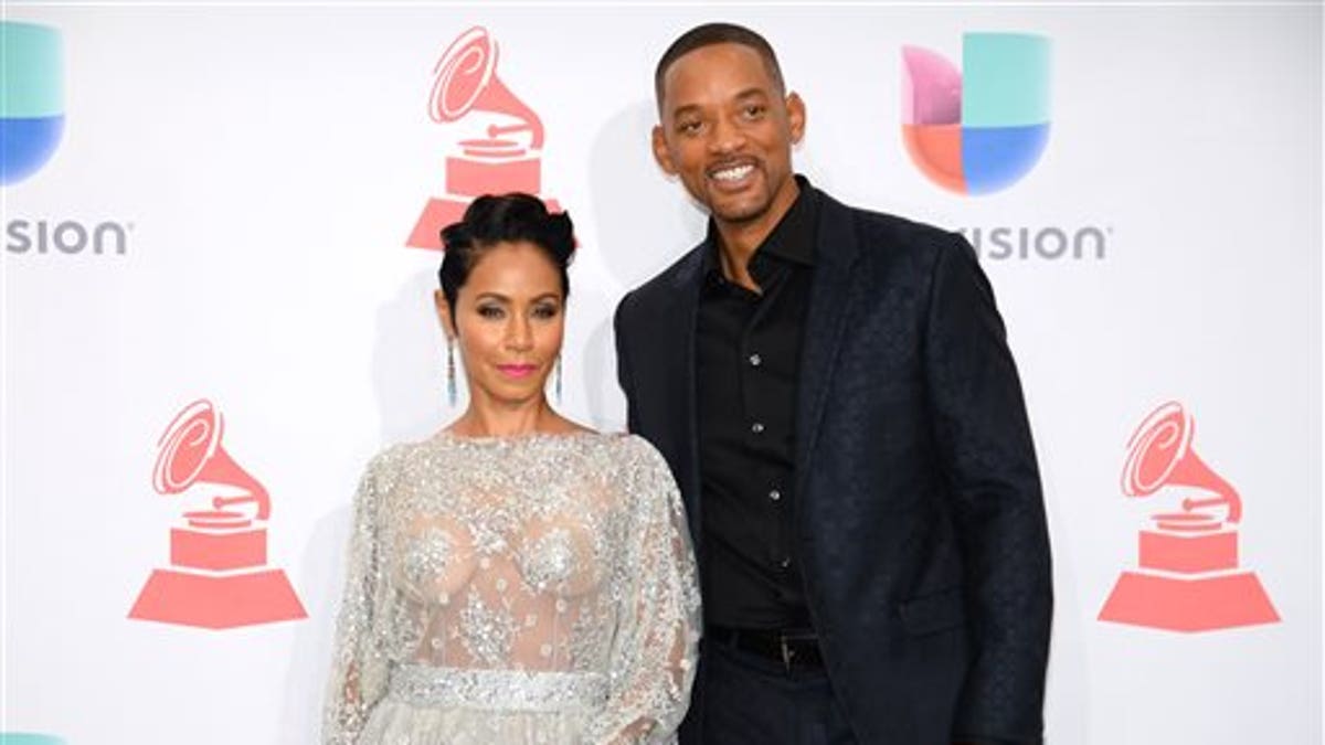 Jada Pinkett Smith, left, and Will Smith  pose in the press room at the 16th annual Latin Grammy Awards at the MGM Grand Garden Arena on Thursday, Nov. 19, 2015, in Las Vegas. (Photo by Al Powers/Invision/AP)