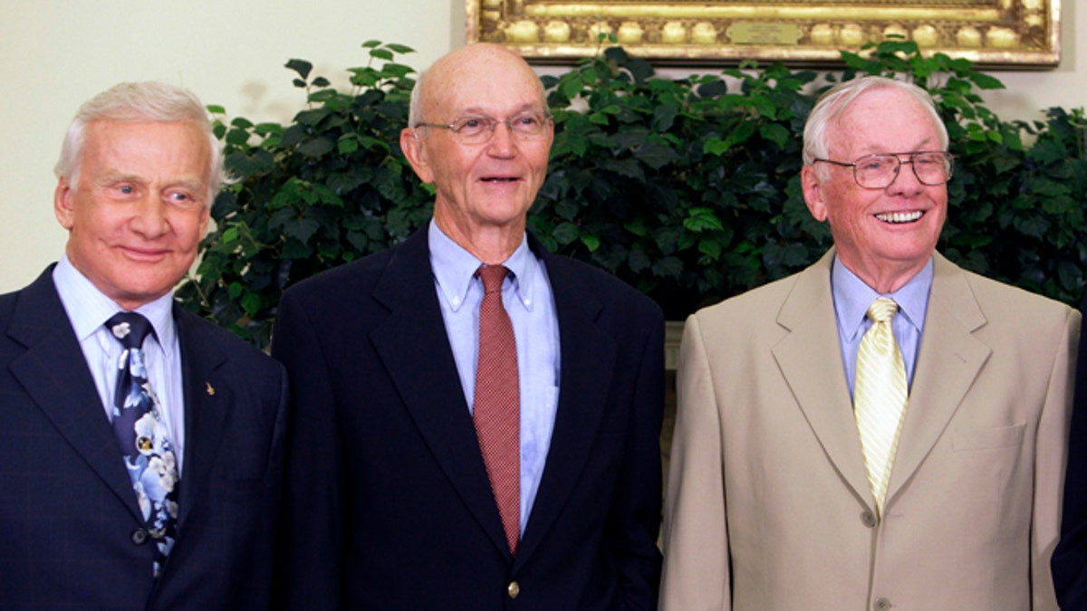 In this July 20, 2009, photo, Buzz Aldrin, left, Michael Collins, center, and Neil Armstrong stand in the Oval Office at the White House in Washington, on the 40th anniversary of the Apollo 11 moon landing.