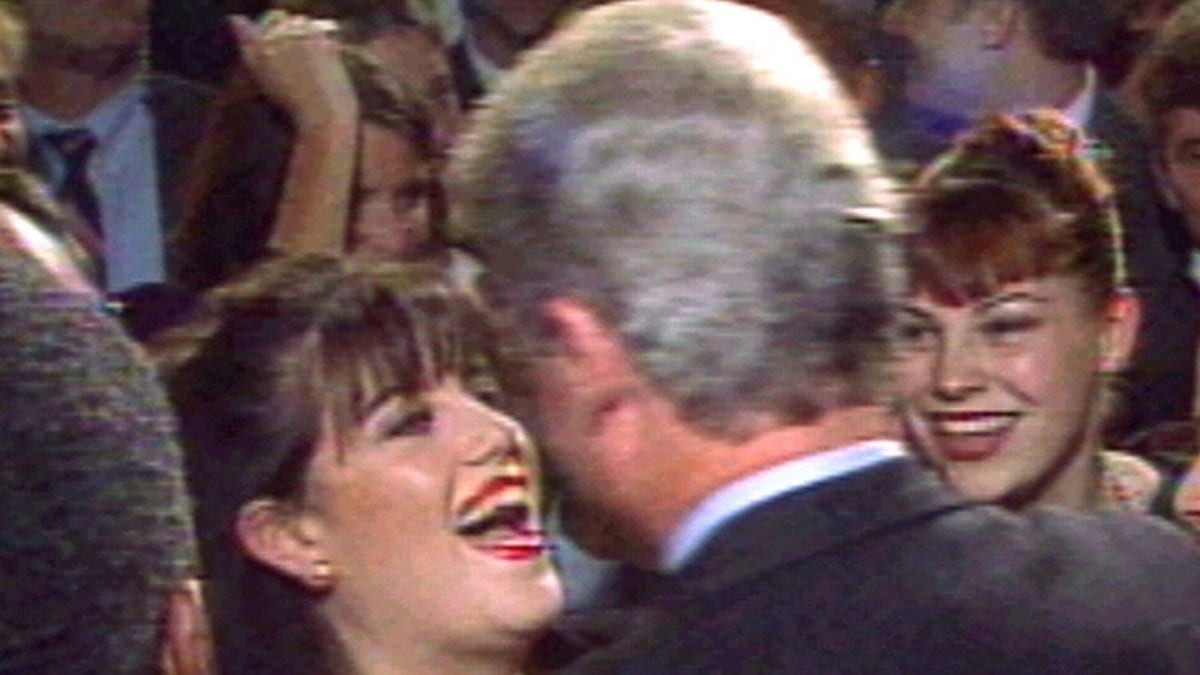 President Clinton greets Monica Lewinsky (L) at a Washington fundraising event in October 1996. (REUTERS/File)