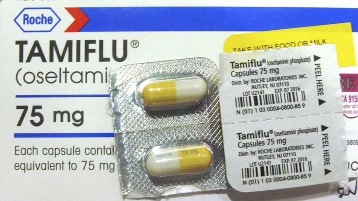 Four Tamiflu capsules are pictured in a box of Tamiflu in Burbank