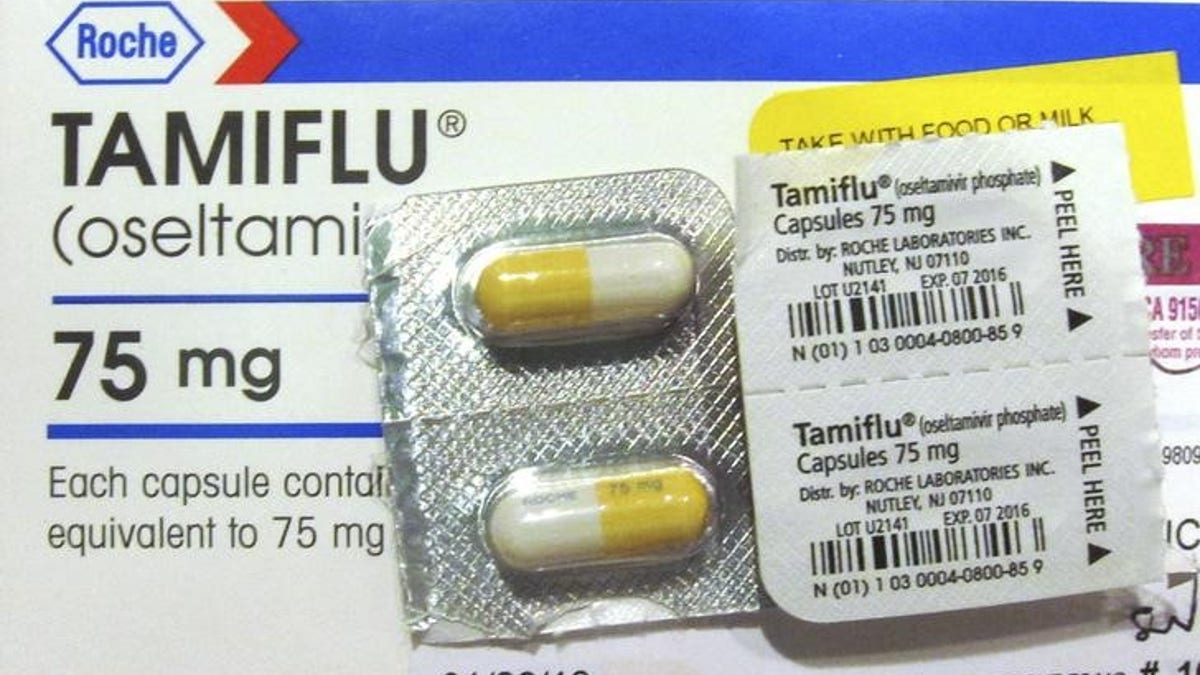 Four capules of Tamiflu are pictured on a Tamiflu box in Burbank