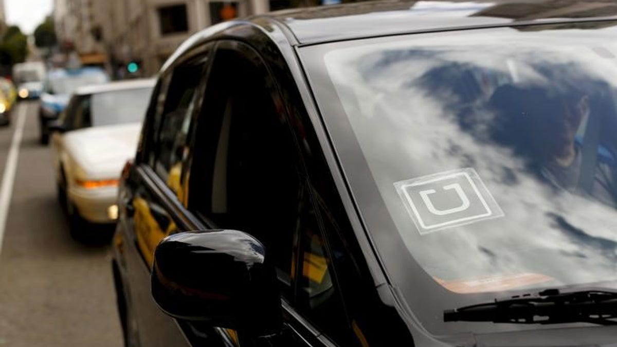 The Uber logo is seen on a vehicle near Union Square in San Francisco, California, U.S. May 7, 2015. REUTERS/Robert Galbraith/File Photo