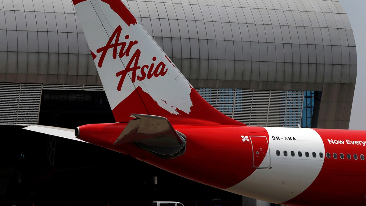 Tail of AirAsia X plane as seen at the Garuda Maintenance Facility AeroAsia in Tangerang, Indonesia, September 20, 2017. Picture taken September 20, 2017. REUTERS/Beawiharta - RC145DAE2560