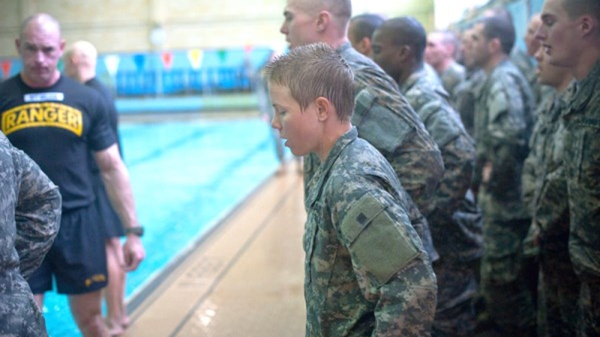 "Male and female Ranger Training Assessment Course students demonstrate their
knowledge of combat water survival techniques at the Briant Wells Gym indoor pool Jan. 24, 2015 during the Ranger Training Course Assessment at Fort Benning,
Georgia. The combat water survival training included a 15-meter swim and a
3-meter blind drop into the water with combat equipment. (U.S. Army photo by
Patrick A. Albright/Released)   
"