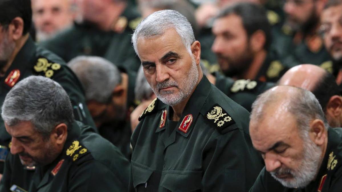 In this Sept. 18, 2016 photo released by an official website of the office of the Iranian supreme leader, Revolutionary Guard Gen. Qassem Soleimani, center, attends a meeting with Supreme Leader Ayatollah Ali Khamenei and Revolutionary Guard commanders in Tehran, Iran. As Saudi Arabia holds a naval drill in the strategic Strait of Hormuz, Soleimani, a powerful Iranian general was quoted, Wednesday, Oct. 5, 2016, by the semi-official Fars and Tasnim news agencies as suggesting the kingdom's deputy crown prince is so 