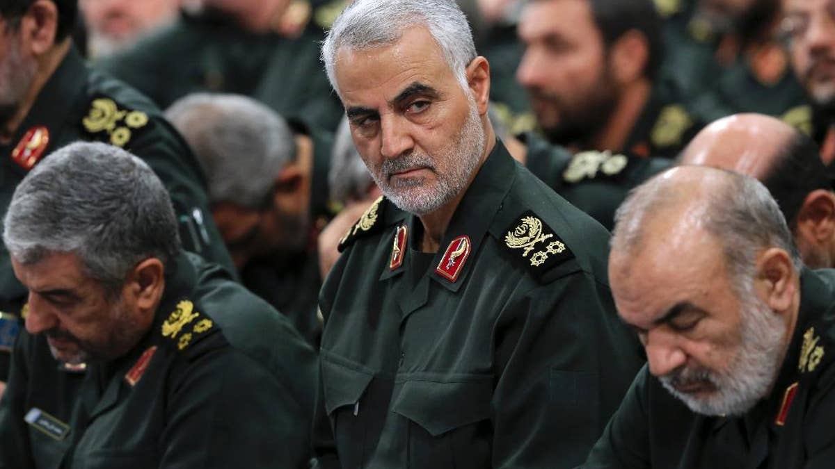 In this Sept. 18, 2016 photo released by an official website of the office of the Iranian supreme leader, Revolutionary Guard Gen. Qassem Soleimani, center, attends a meeting with Supreme Leader Ayatollah Ali Khamenei and Revolutionary Guard commanders in Tehran, Iran. As Saudi Arabia holds a naval drill in the strategic Strait of Hormuz, Soleimani, a powerful Iranian general was quoted, Wednesday, Oct. 5, 2016, by the semi-official Fars and Tasnim news agencies as suggesting the kingdom's deputy crown prince is so 