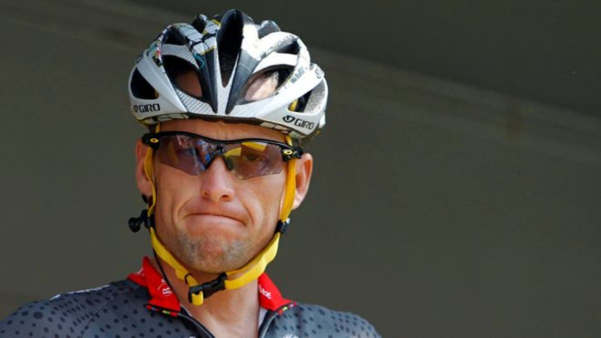 FILE - In this July 6, 2010, file photo, Lance Armstrong grimaces prior to the start of the third stage of the Tour de France cycling race in Wanze, Belgium. Armstrong said on Thursday, Aug. 23, 2012, that he is finished fighting charges from the United States Anti-Doping Agency that he used performance-enhancing drugs during his unprecedented cycling career, a decision that could put his string of seven Tour de France titles in jeopardy. (AP Photo/Christophe Ena, File)