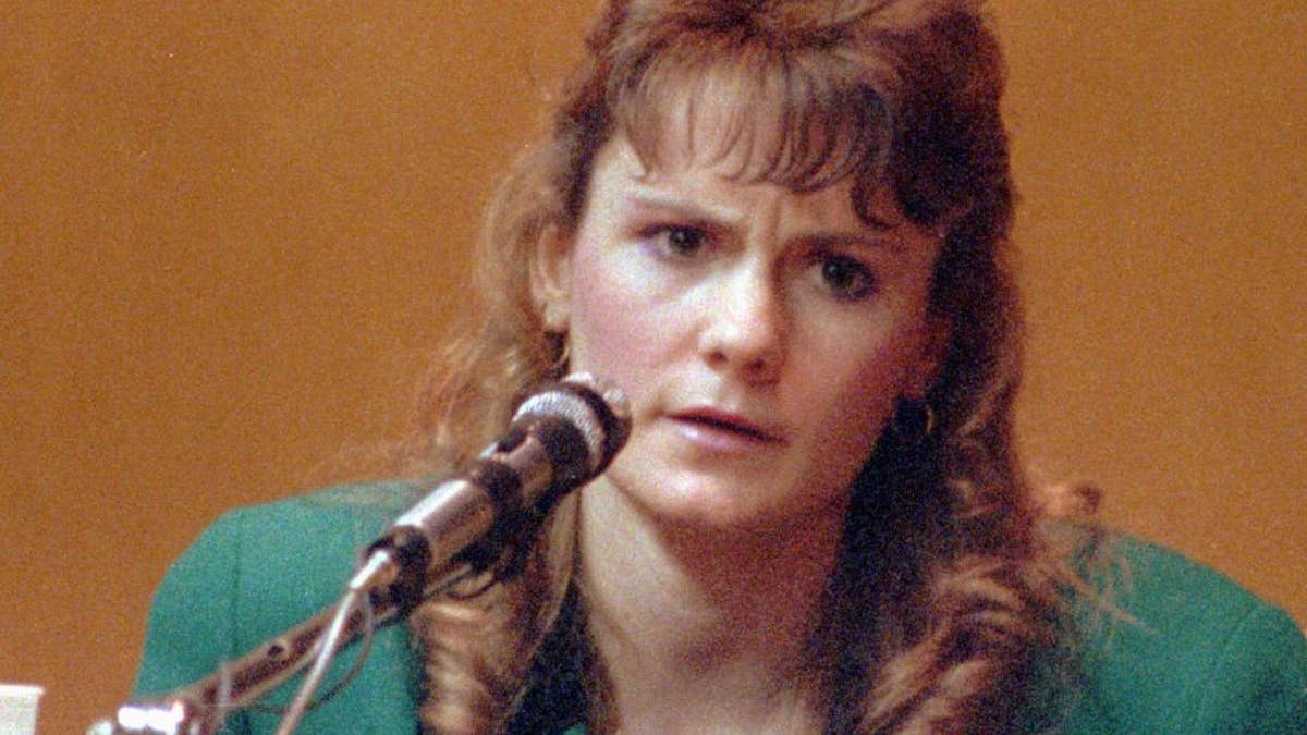 FILE - In this 1991 file photo Pamela Smart, testifies in Rockingham County Superior Court in Exeter, N.H. Patrick Randall held a knife to Gregory Smart's throat in May 1990 as Billy Flynn, who was Pamela Smart's teenage lover, shot him in the head. Flynn was paroled last month; Smart is serving life without parole after being convicted of plotting the murder. (AP Photo/Jim Cole, File)