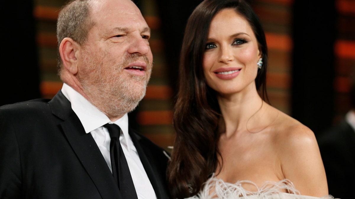 Producer Harvey Weinstein and his wife, actress Georgina Chapman arrive at the 2014 Vanity Fair Oscars Party in West Hollywood, California March 2, 2014.