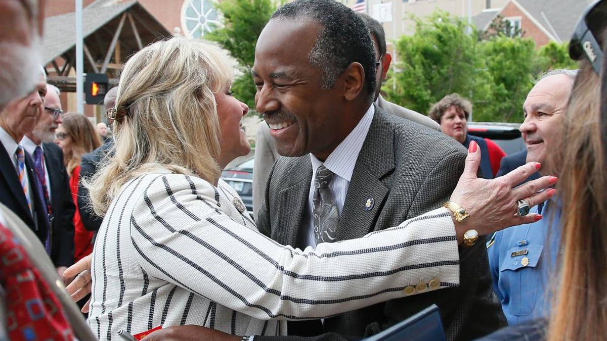 Oklahoma Gov. Mary Fallin, left, greets Housing and Urban Development Ben Carson, M.D., right, before the start of the 22nd Anniversary Remembrance Ceremony of the Oklahoma City bombing in Oklahoma City, Wednesday, April 19, 2017. Carson is speaking at the ceremony. (AP Photo/Sue Ogrocki)