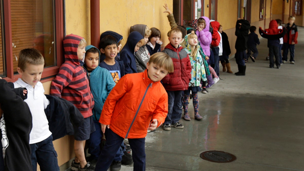Jan. 24, 2013: A first grade class of 30 children waits to enter a classroom at the Willow Glenn Elementary School in San Jose, Calif. 