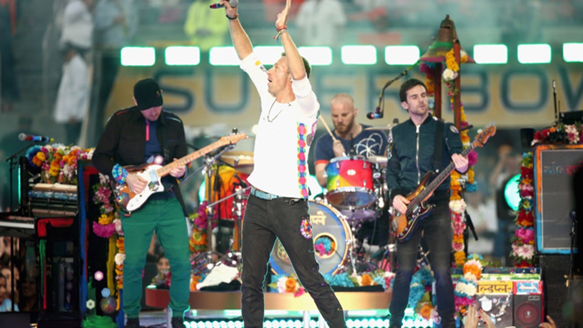 SANTA CLARA, CA - FEBRUARY 07:  Jonny Buckland, Chris Martin, Guy Berryman and Will Champion of Coldplay perform onstage during the Pepsi Super Bowl 50 Halftime Show at Levi's Stadium on February 7, 2016 in Santa Clara, California.  (Photo by Christopher Polk/Getty Images)