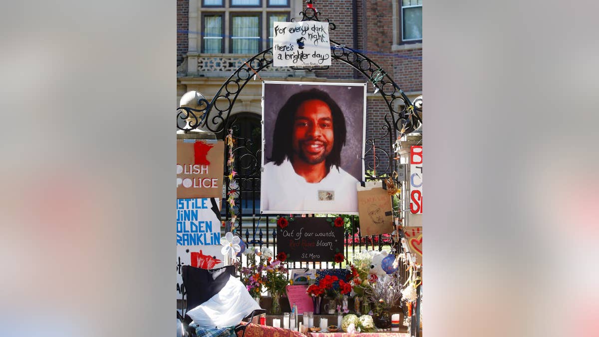 FILE - In this July 25, 2016, file photo, a memorial including a photo of Philando Castile adorns the gate to the governor's residence where protesters continue to demonstrate in St. Paul, Minn., against the July 6, 2016, shooting death of Castile by St. Anthony police Officer Jeronimo Yanez during a traffic stop in Falcon Heights, Minn. Yanez is expected to enter his plea on manslaughter charges during a hearing Monday, Feb. 27, 2017. (AP Photo/Jim Mone, File)