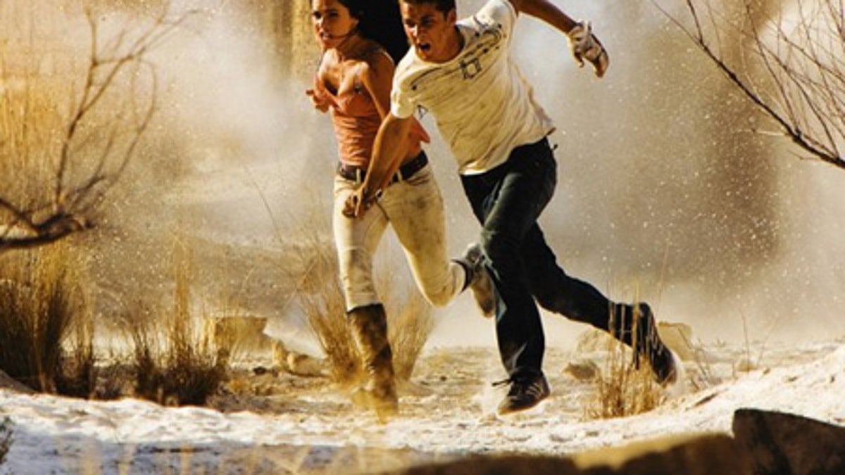 Actors Megan Fox (L) and Shia LaBeouf are shown in a scene from the Paramount Pictures film 