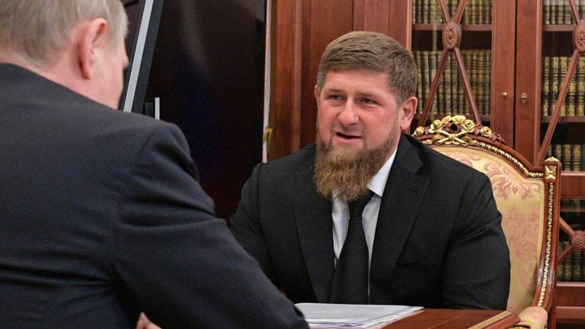 In this photo taken Wednesday, April 19, 2017, Russian President Vladimir Putin, left, meets with Chechnya's regional leader Ramzan Kadyrov in the Kremlin in Moscow, Russia. Putin met late Wednesday with Kadyrov, who told the president not to believe the "provocative" articles, reporting detentions and killings of gay men in Chechnya, which he says have no basis in fact. (Alexei Druzhinin/Sputnik, Kremlin Pool Photo via AP)