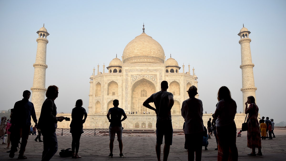 Tourists visit India's famed monument of love, the Taj Mahal, in Agra, India, Thursday, March 22, 2018. The 17th century white marble monument is India's biggest tourist draw, with about 3 million visiting every year. (AP Photo/R.S. Iyer)