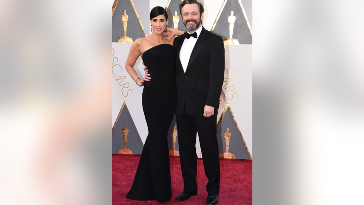 Sarah Silverman, left, and Michael Sheen arrive at the Oscars on Sunday, Feb. 28, 2016, at the Dolby Theatre in Los Angeles. (Photo by Jordan Strauss/Invision/AP)