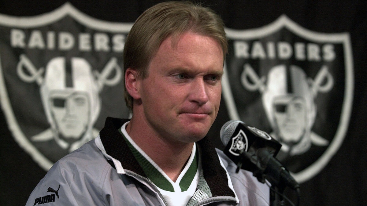 FILE - In this Jan. 14, 2001, file photo, then-Oakland Raiders' coach Jon Gruden is shown during a press conference at Raiders headquarters in Alameda, Calif. The Raiders are set to bring Jon Gruden back for a second stint as coach. A person with knowledge of the team's plans said the Raiders are planning a news conference Tuesday to announce that Gruden is leaving the broadcast booth to come back to coaching. The person spoke on condition of anonymity because the team has made no formal announcement. (AP Photo/Ben Margot, File)