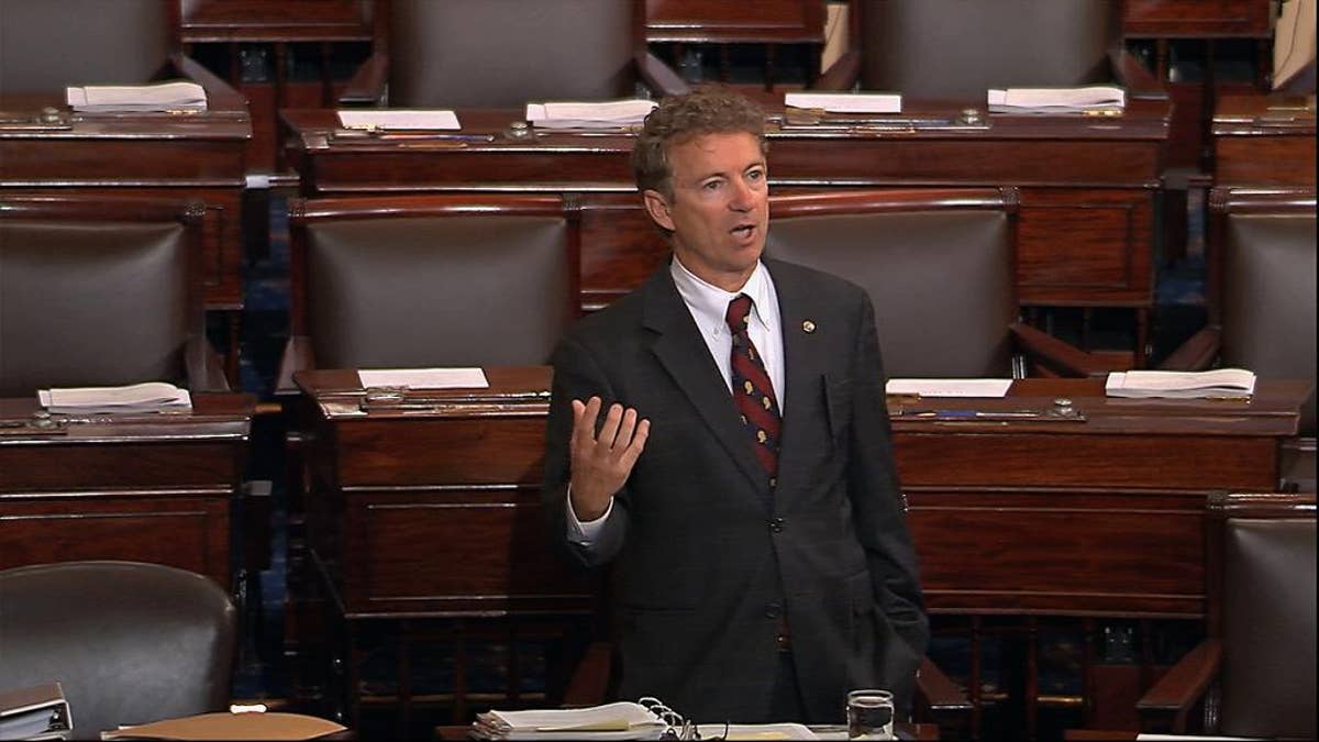 In this image from Senate video, Sen. Rand Paul, R-Ky., and a Republican presidential contender, speaks on the floor of the U.S. Senate Wednesday afternoon, May 20, 2015, at the Capitol in Washington, during a long speech opposing renewal of the Patriot Act. Paul claimed he was filibustering, but under the Senate rules, he wasn’t. (Senate TV via AP)