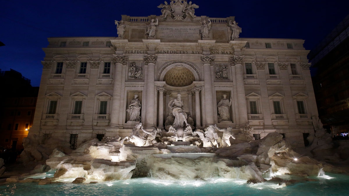 The newly restored Trevi Fountain is lit during the official inauguration in Rome, Tuesday, Nov. 3, 2015. The historical fountain, famed as a setting for the film 