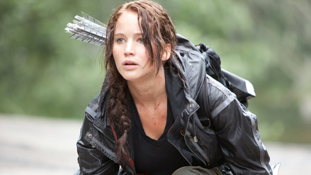 In this image released by Lionsgate, Jennifer Lawrence portrays Katniss Everdeen in a scene from "The Hunger Games." (AP Photo/Lionsgate, Murray Close)
