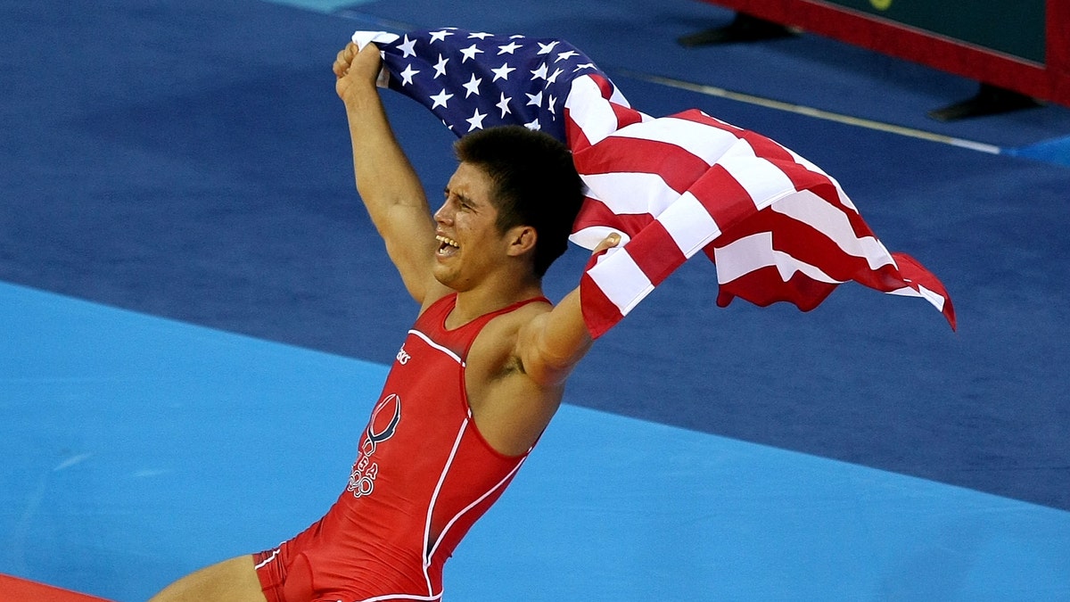 BEIJING - AUGUST 19: Henry Cejudo of the United States celebrates after defeating Shingo Matsumoto of Japan to win the gold medal in the men's 55kg freestyle wrestling event at the China Agriculture University Gymnasium on Day 11 of the Beijing 2008 Olympic Games on August 19, 2008 in Beijing, China. (Photo by Jed Jacobsohn/Getty Images)