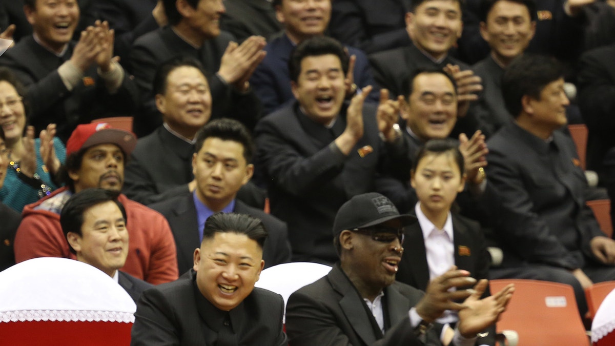 FILE - North Korean leader Kim Jong Un, left, and former NBA star Dennis Rodman watch North Korean and U.S. players in an exhibition basketball game at an arena in Pyongyang, North Korea, Thursday, Feb. 28, 2013. Rodman arrived in Pyongyang on Monday with three members of the Harlem Globetrotters basketball team to shoot an episode on North Korea for a new weekly HBO series. (AP Photo/VICE Media, Jason Mojica, File)