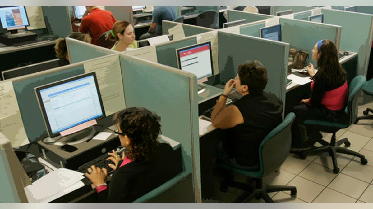 Job seekers search for jobs on the computers at the South Florida Workforce office in Miami, Friday, Dec. 5, 2008. (AP Photo/Alan Diaz)