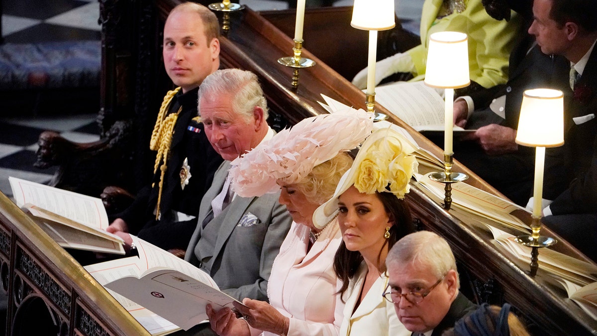 From left, Britain's Prince William, Prince Charles, Camilla Duchess of Cornwall, Kate Duchess of Cambridge, Prince Andrew and Princess Beatrice at the wedding ceremony of Prince Harry and Meghan Markle at St. George's Chapel in Windsor Castle in Windsor, near London, England, Saturday, May 19, 2018. (Owen Humphreys/pool photo via AP)