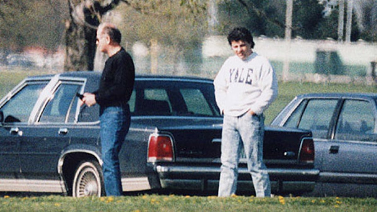This undated surveillance photo released by the U.S. Attorney's office at federal court in Boston shows James 'Whitey' Bulger, left, with his former right hand man, Kevin Weeks.