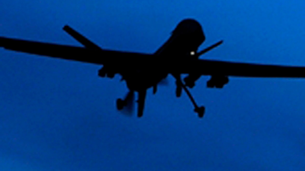 A U.S. Predator drone flies over the moon above Kandahar Air Field, southern Afghanistan Sunday, Jan. 31, 2010. The Pakistani army said Sunday that it was investigating reports that Pakistani Taliban leader Hakimullah Mehsud died from injuries sustained in a U.S. drone missile strike in mid-January. (AP Photo/Kirsty Wigglesworth)