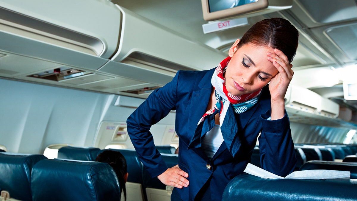 Distressed flight attendant sad angry flight