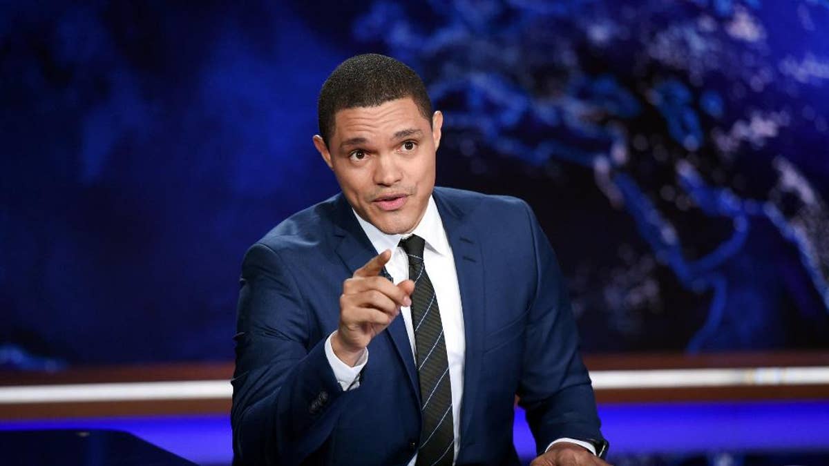 FILE - In this Sept. 29, 2015, file photo, Trevor Noah works on set during a taping of 