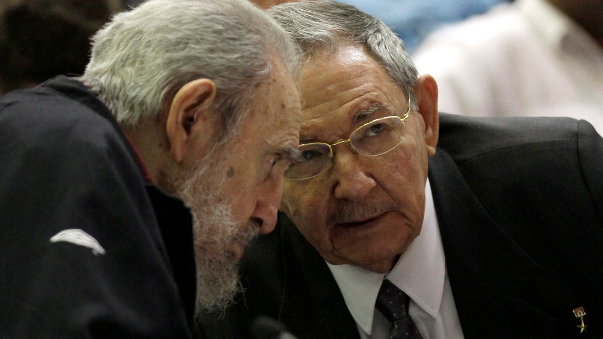 Cuba's leader Fidel Castro and his brother Cuba's President Raul Castro talk during the opening session of the National Assemby in Havana, Cuba, Sunday, Feb. 24, 2012. Cuba's parliament reconvened Sunday with new membership and was expected to name Raul Castro to a new five-year-term as president. Raul Castro fueled speculation on Friday when he talked of his possible retirement and suggested he has plans to resign at some point.(AP Photo/Ismael Francisco, Cubadebate)