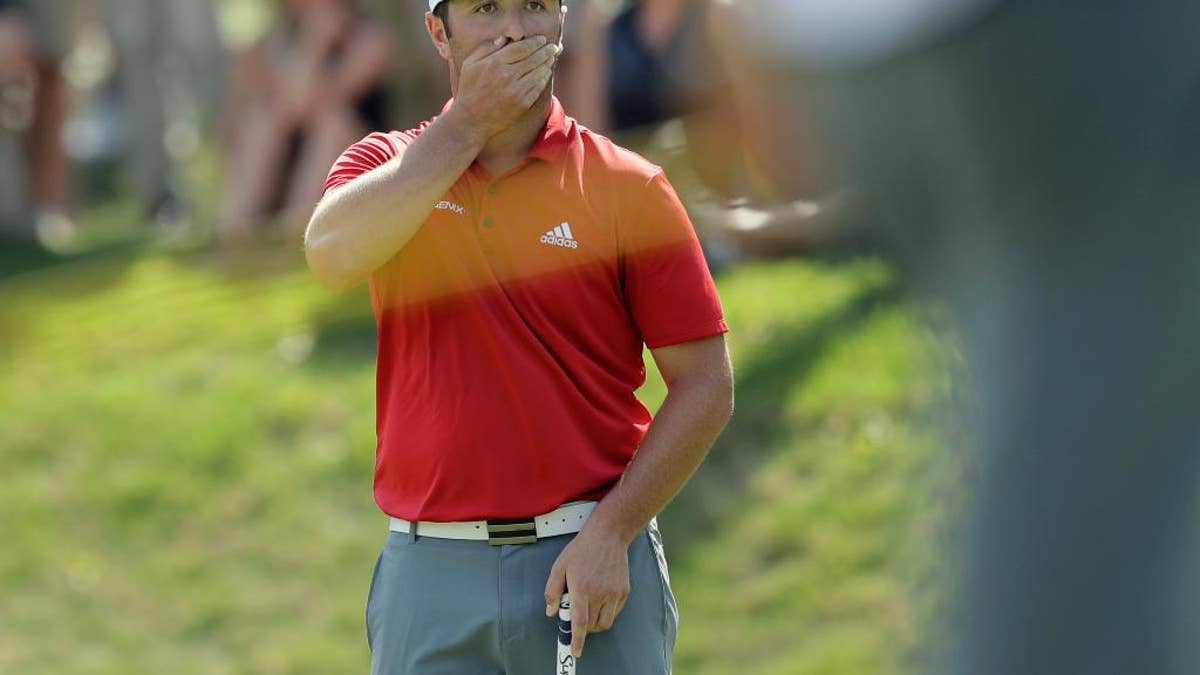 Jon Rahm, of Spain, reacts after his putt rolled off the green on the seventh hole during the final round of play against Dustin Johnson at the Dell Technologies Match Play golf tournament at Austin County Club, Sunday, March 26, 2017, in Austin, Texas. (AP Photo/Eric Gay)