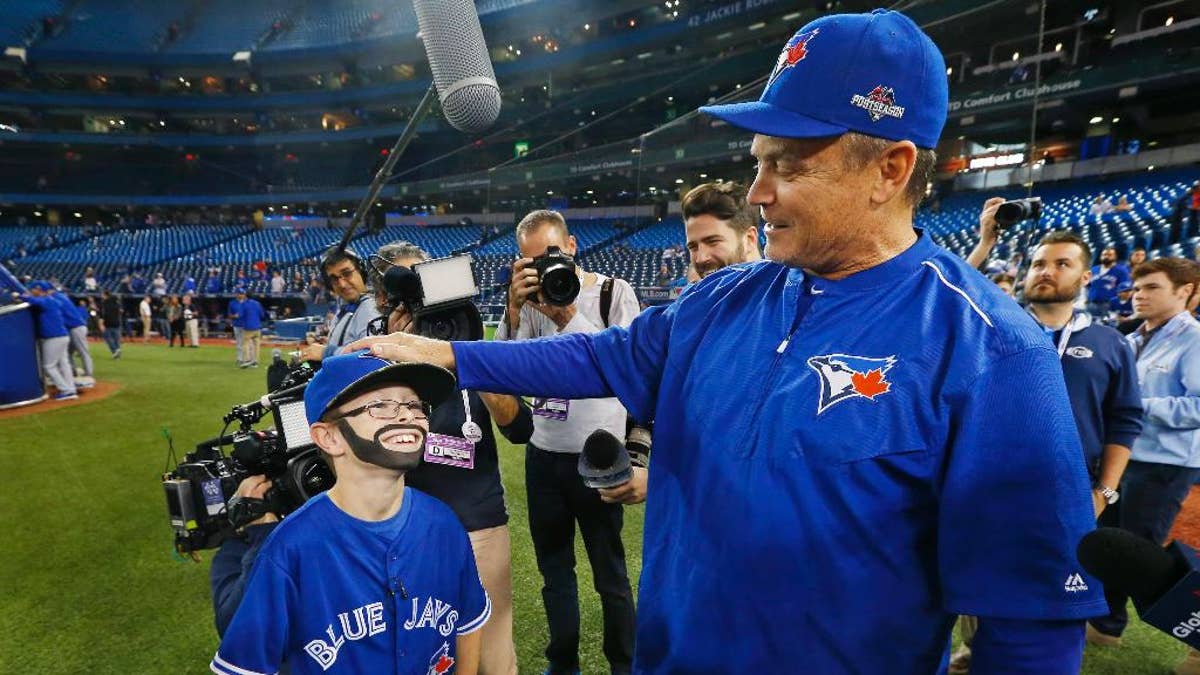 9-year-old Oscar Wood, known as 'Mini Bautista,' become a big hit with Blue  Jays fans