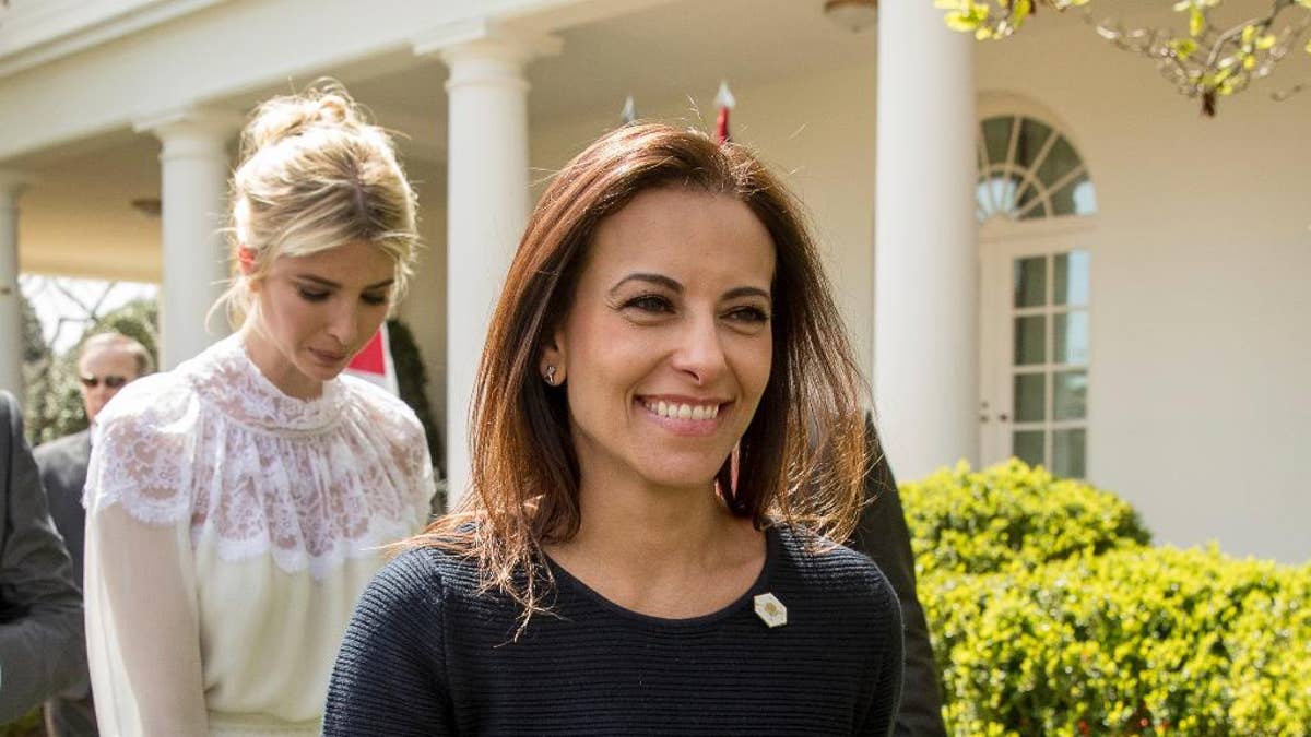 In this photo take April 5, 2017, White House Senior Counselor for Economic Initiatives Dina Powell, followed by Ivanka Trump, leave news conference in the Rose Garden at the White House in Washington. In a White House split between outsider ideologues and more traditional operators, Powell is viewed as a steady force in the growing influence of the latter. A newer addition to the team, her West Wing experience, conservative background and policy chops have won over Trump’s daughter and son-in-law. Now, as the president turns his attention to international affairs, attempting to craft a foreign policy out of a self-described “flexible” approach to the world, Powell is at the table. (AP Photo/Andrew Harnik)