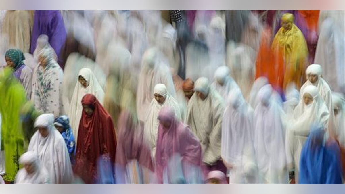 Muslim women offer an evening prayer 