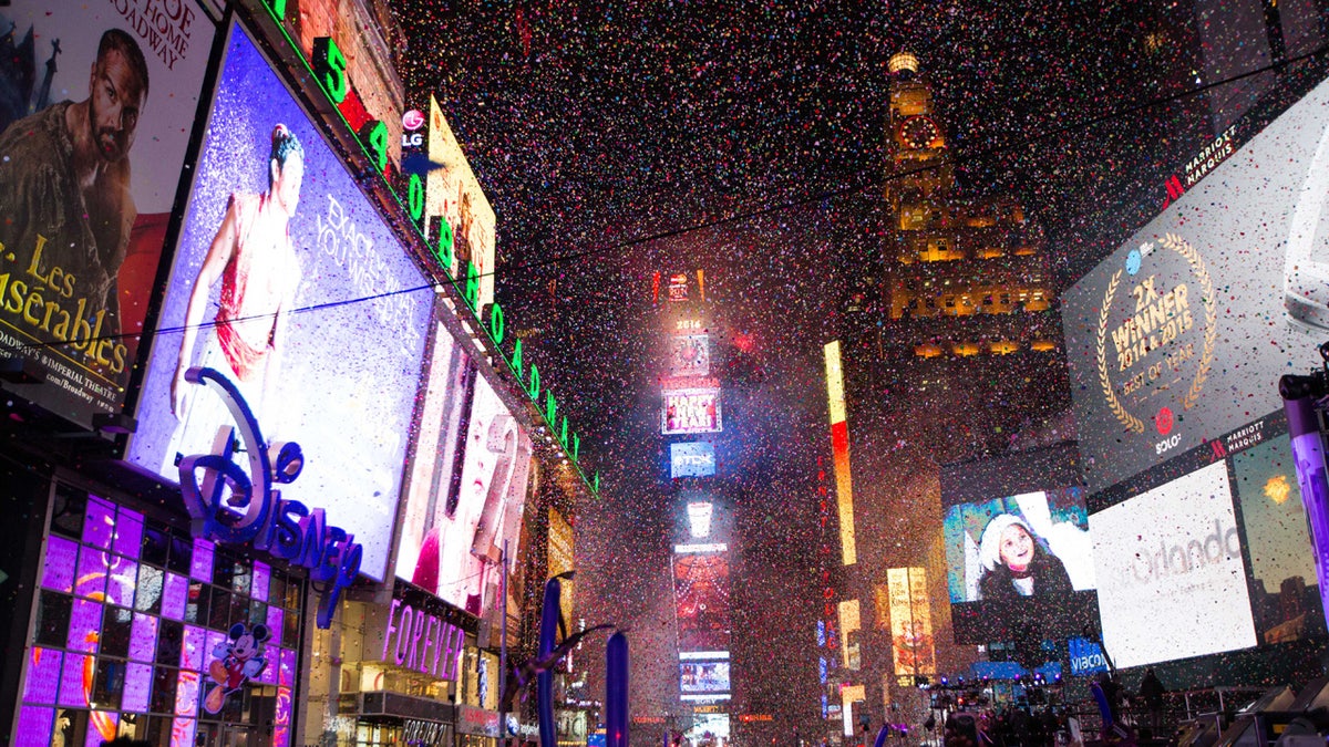 Confetti falls during the annual New Year's Eve celebration in Times Square on Friday, Jan. 1, 2016, in New York. (AP Photo/Kevin Hagen)