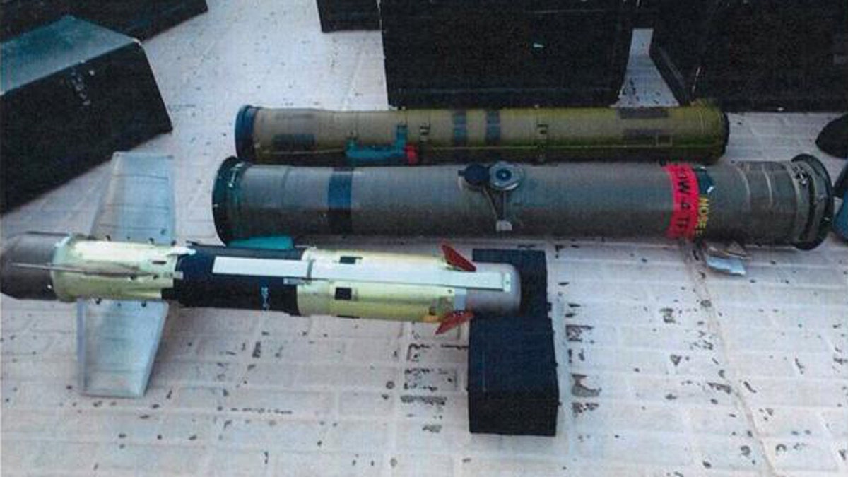 In this image posted on the official Twitter account of the Saudi Press agency, SPA, Tuesday, Sept. 30, 2015, confiscated weapons are seen aboard an Iranian fishing boat bound for Yemen. The Saudi-led coalition battling Yemen's Shiite rebels says it has foiled an attempt by Iran to smuggle missiles and other weapons to the rebels aboard a fishing boat. The coalition says in a statement released Wednesday that the seizure took place on Saturday some 241 kilometers (150 miles) southeast of the Omani port of Salalah. (Saudi Press Agency via AP)