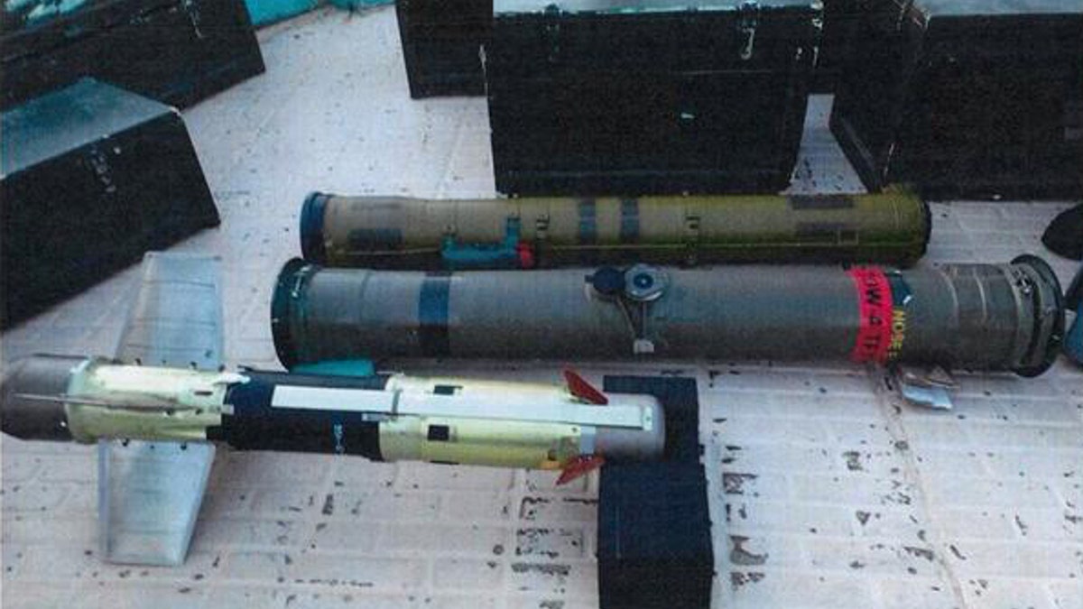 In this image posted on the official Twitter account of the Saudi Press agency, SPA, Tuesday, Sept. 30, 2015, confiscated weapons are seen aboard an Iranian fishing boat bound for Yemen. The Saudi-led coalition battling Yemen's Shiite rebels says it has foiled an attempt by Iran to smuggle missiles and other weapons to the rebels aboard a fishing boat. The coalition says in a statement released Wednesday that the seizure took place on Saturday some 241 kilometers (150 miles) southeast of the Omani port of Salalah. (Saudi Press Agency via AP)