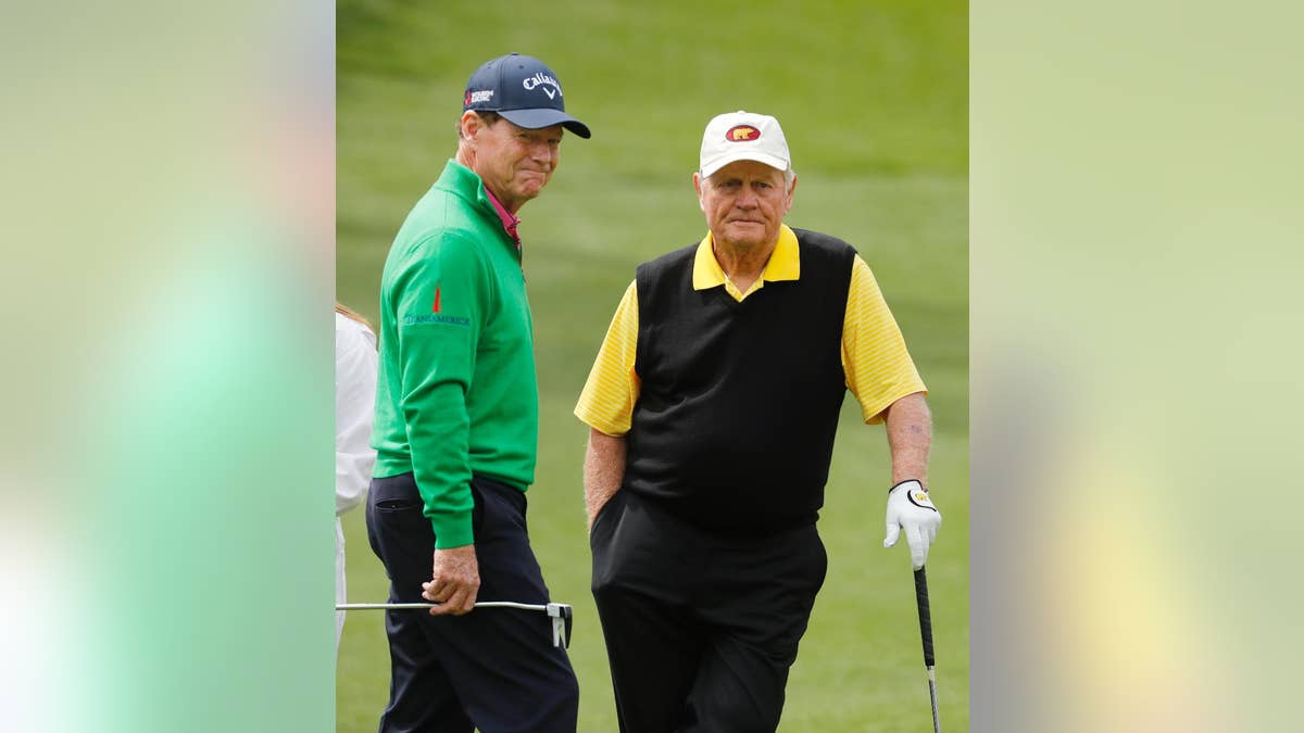 Tom Watson, left, talks to Jack Nicklaus on the second hole during the par three competition at the Masters golf tournament Wednesday, April 6, 2016, in Augusta, Ga. (AP Photo/Chris Carlson)